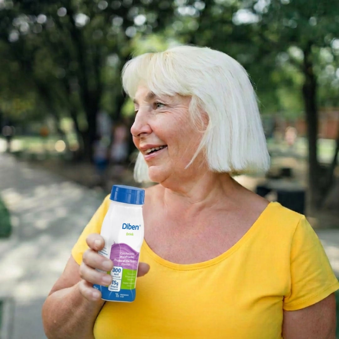 A woman holds enjoys Fresubin's Fruits-of-the-Forest-flavoured Diben Drink to support his nutritional needs and diabetes management. 