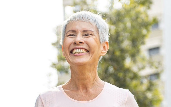 A woman smiles knowing she is supported by Fresubin's range of oral nutritional supplements. 