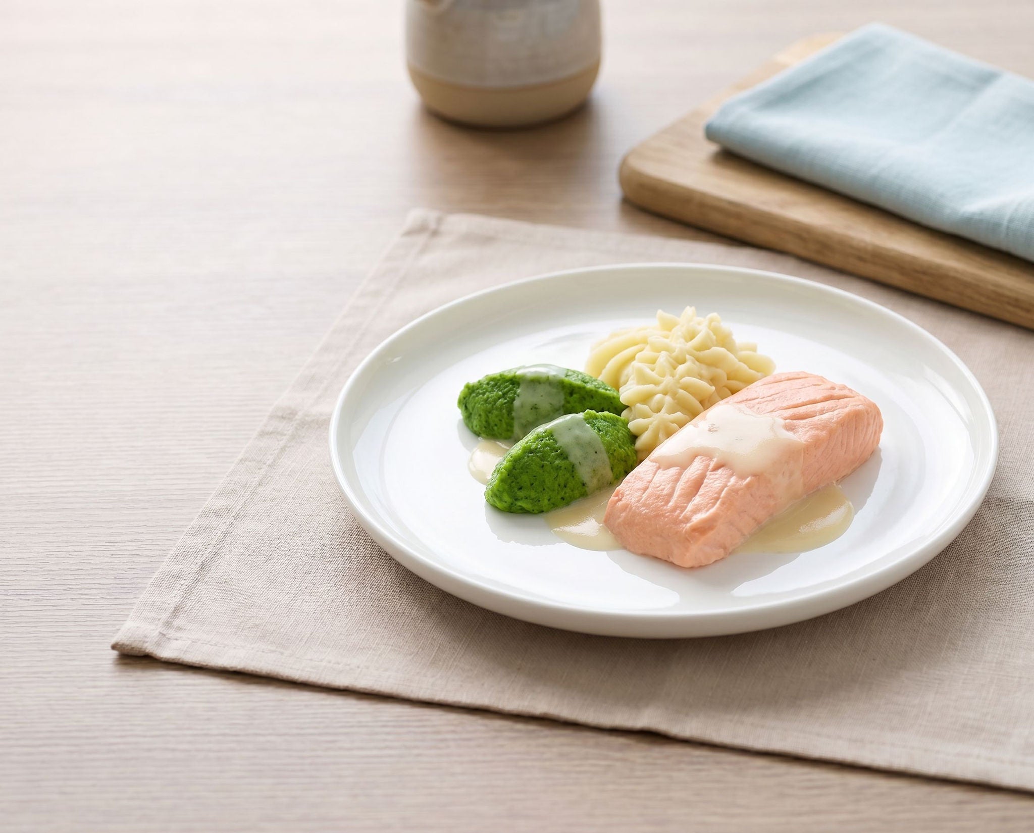 Poached salmon filet with vegetables