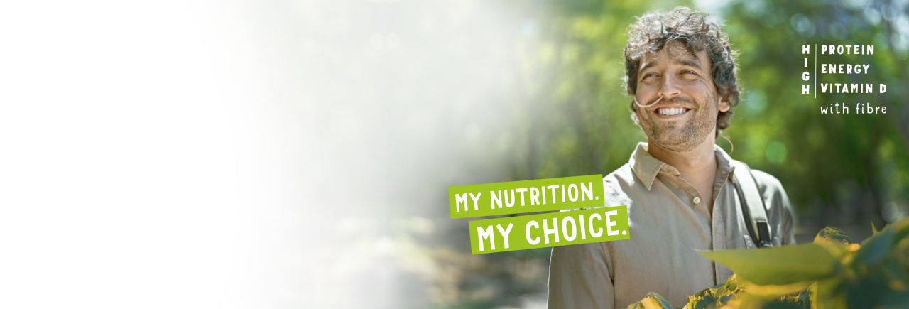 Man smiling outdoors, symbolizing natural vitality and wellbeing supported by Fresubin PLANT-BASED Tube Feed.