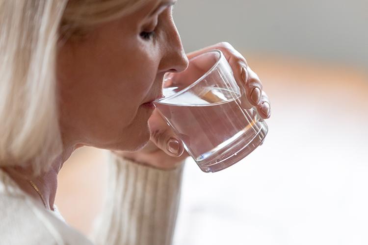 woman drinking glass of water