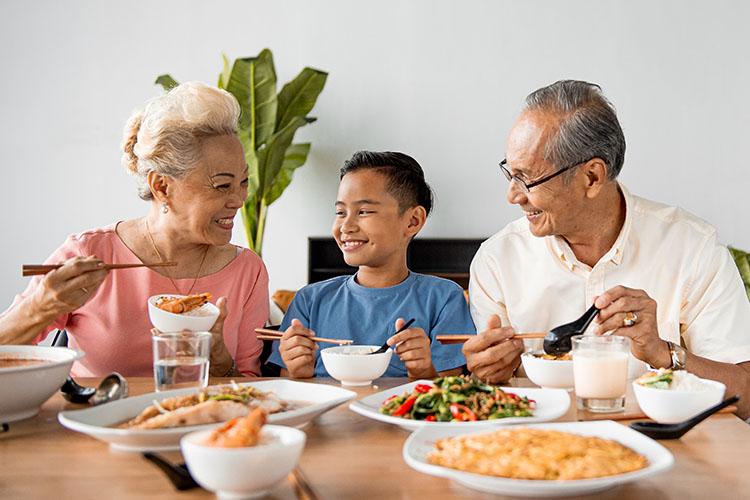 grandparents and kid eating together