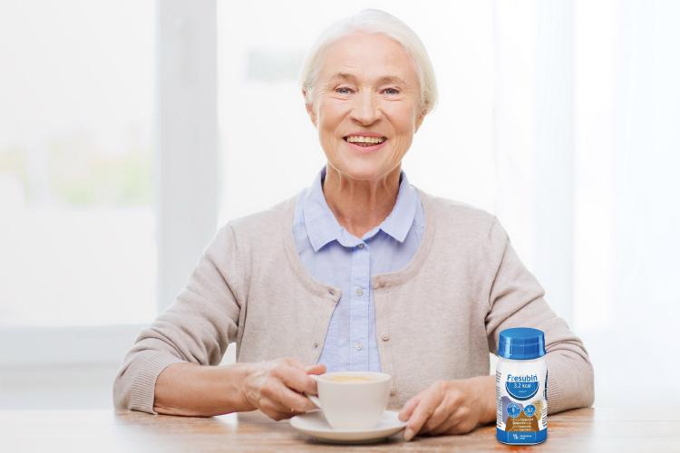 Woman enjoying Fresubin 3.2 kcal DRINK Cappuccino