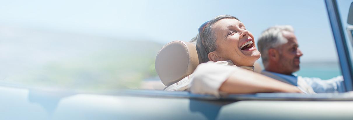 Woman in convertical car enjoying freedom